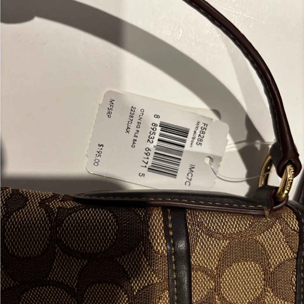 Coach Signature File Bag - Style F58285
Classic Khaki canvas with leather trim - Picture 6 of 6